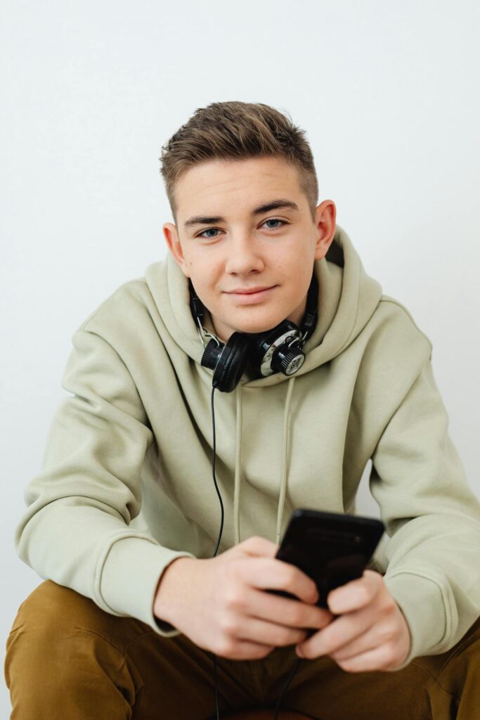 Young man listening to audio recording, practicing self-hypnosis | hypnotherapy for tourette syndrome | wellbeing blog